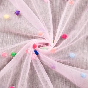 Tulle with pom-poms