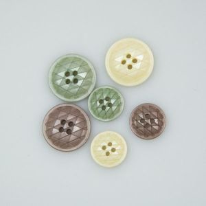 Button with geometric pattern